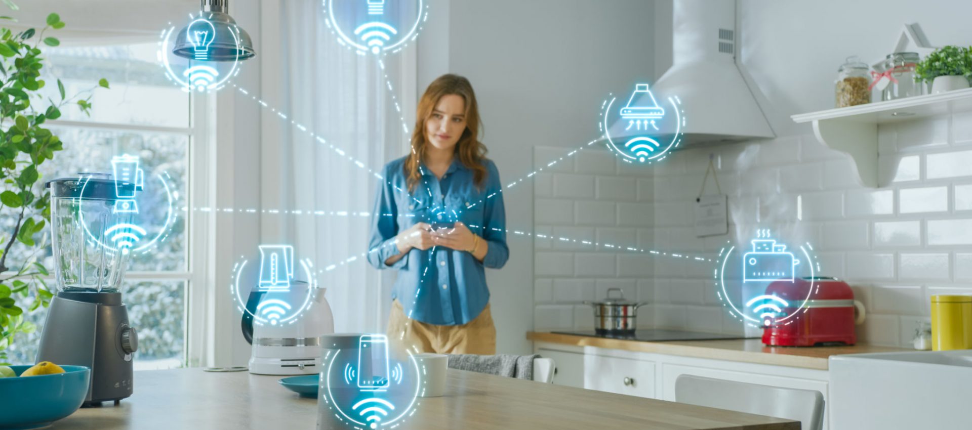 Internet of Things Concept: Young Woman Using Smartphone in Kitchen. She controls her Kitchen Appliances with IOT. Graphics Showing Digitalization Visualization of Connected Home Electronics Devices